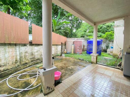 Covered patio area with garden view