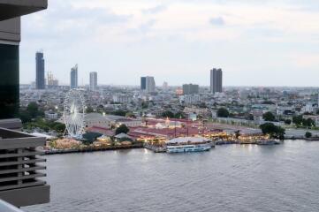 Cityscape view with river and Ferris wheel