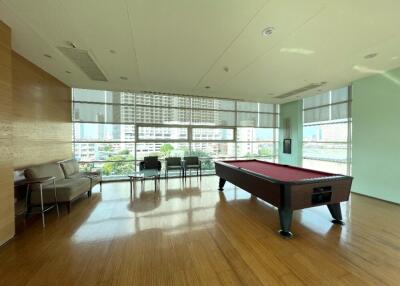 Modern recreational area with pool table and seating