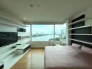 High-rise apartment bedroom with city and river view