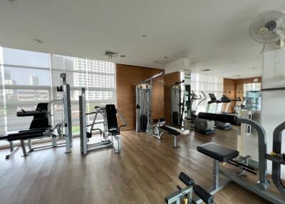 Modern fitness center with various exercise equipment