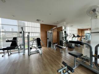 Modern fitness center with various exercise equipment