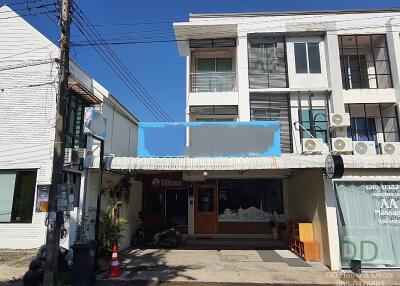 Modern three-story commercial building on a sunny day