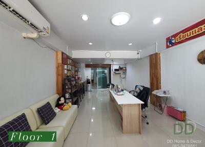 Spacious living room with seating area and desk