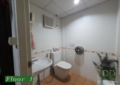 Bathroom with sink, toilet, and tiled floor