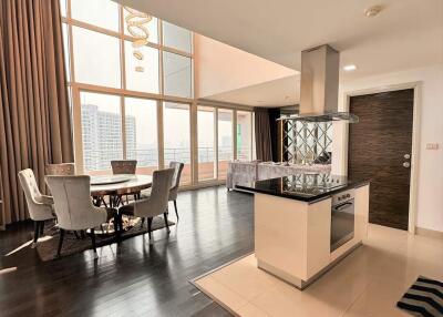 Spacious modern living area with a dining table and kitchen island