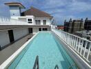 Building with rooftop pool and city view