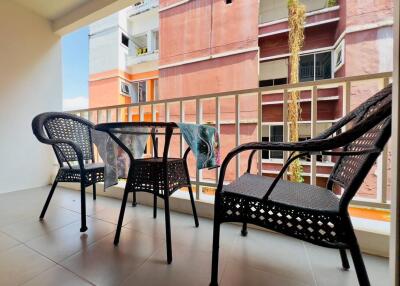 Outdoor balcony with chairs and table