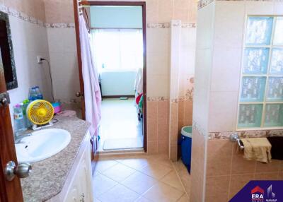 Bathroom with granite countertop and tiled floor