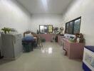 Spacious kitchen with various appliances and storage