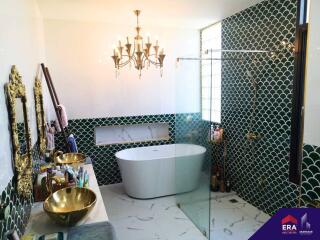 Luxurious bathroom with elegant fixtures and freestanding tub