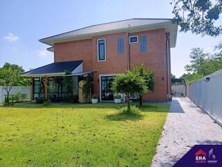 Modern two-story house with a spacious lawn