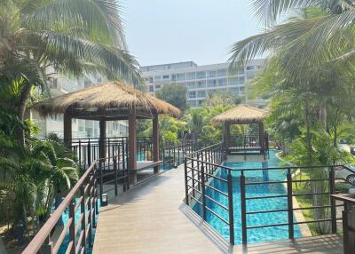 Beautiful outdoor area with pool and cabanas