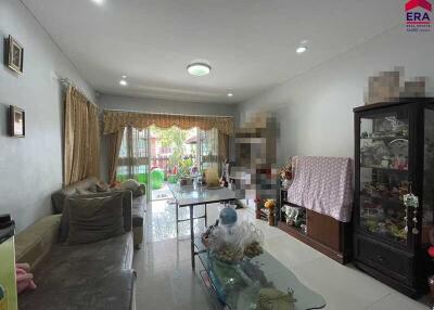Spacious living room with modern furnishings and abundant natural light