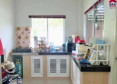 Well-lit kitchen with modern appliances