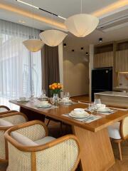 Modern dining area with wooden table and chairs