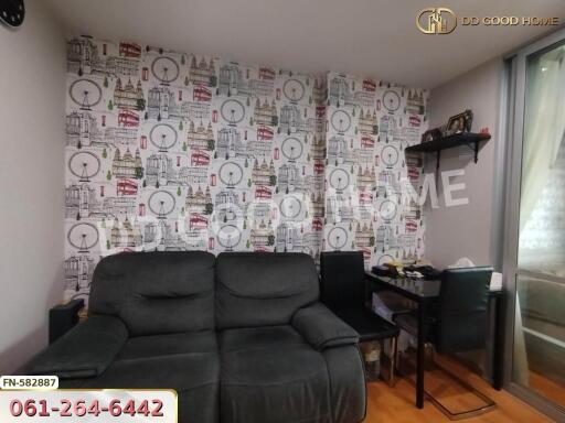 Living room with gray sofa and desk