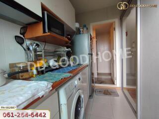 Kitchen area with appliances and storage