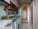 Kitchen area with appliances and storage