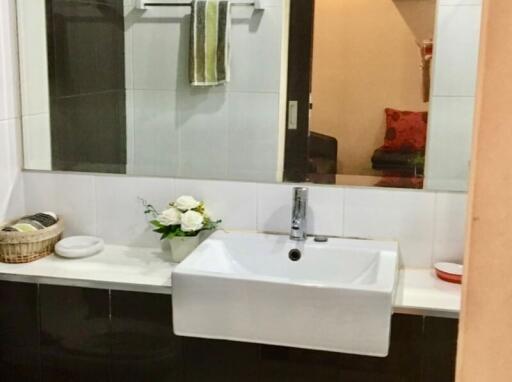 Modern bathroom with a large mirror and sink