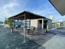 Rooftop area of a building with seating and shade structures