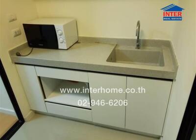 Compact kitchen with microwave and sink