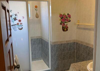 Bathroom with shower, sink, and toilet