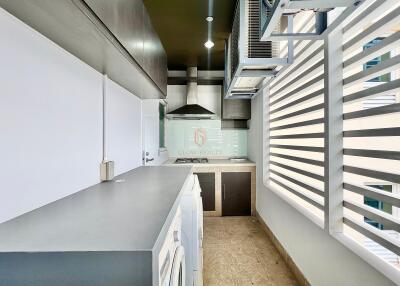 Modern kitchen with sleek countertops and ample natural light