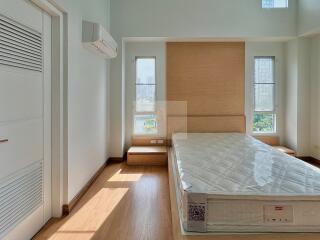 Spacious bedroom with large windows