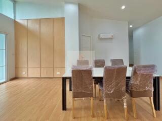 Dining area with large table and chairs in a modern room