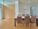 Dining area with large table and chairs in a modern room