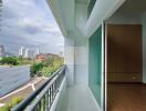 view from the balcony overlooking buildings and trees