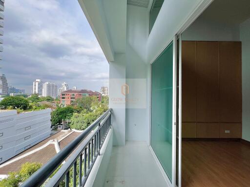 view from the balcony overlooking buildings and trees