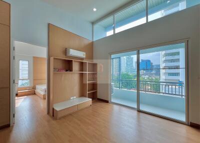 Spacious bedroom with balcony and built-in storage