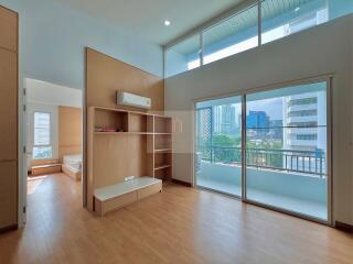 Spacious bedroom with balcony and built-in storage