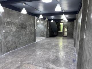 Main living area with industrial concrete finish