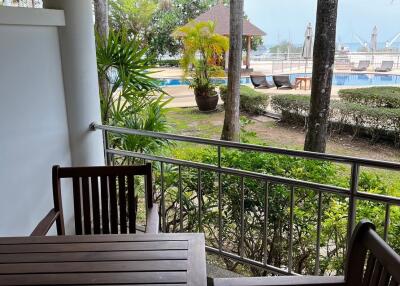 Balcony overlooking pool and garden