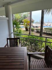 Balcony overlooking pool and garden