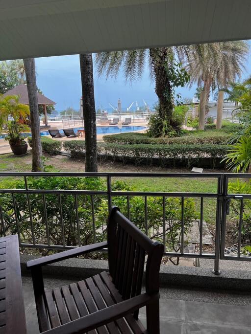 Patio view with garden and pool