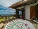 Outdoor luxury area with bathtub and ocean view