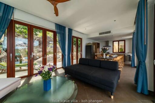 Spacious living area with modern furniture and large windows