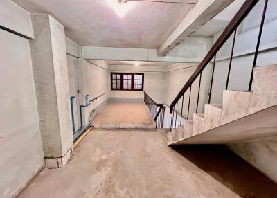 Unfinished basement with staircase