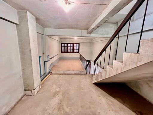 Unfinished basement with staircase