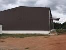 Exterior view of a large building with brown siding