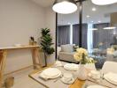 Modern dining area leading into cozy living room