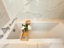 Modern bathroom with marble tiles and a bathtub