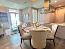 Modern dining area adjacent to a cozy living room with natural light