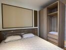 Modern bedroom with a bed and wooden wardrobe