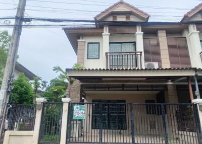 Two-story house with a gated front yard