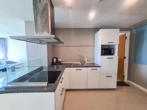 Modern kitchen with integrated appliances and breakfast bar